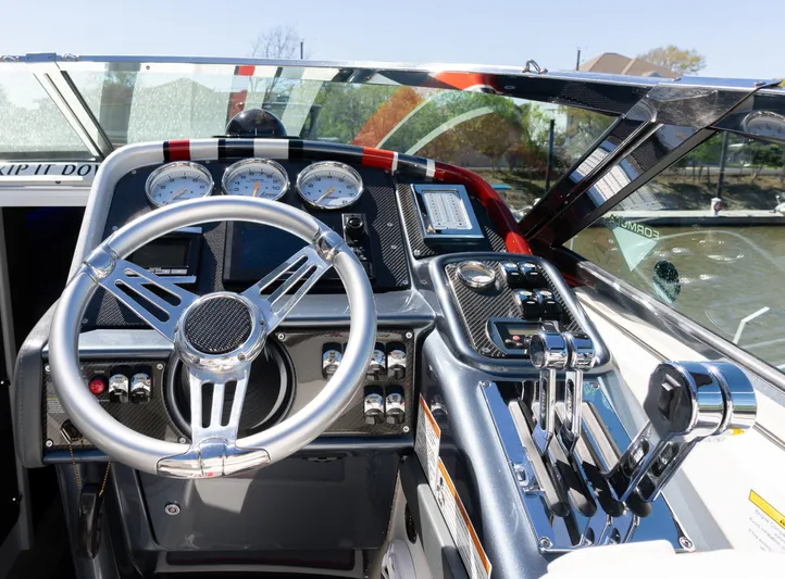  Yacht Photos Pics 2017 Formula 382 FASTech boat cockpit with steering wheel and control panel.