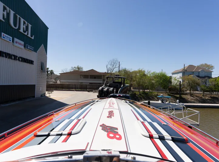  Yacht Photos Pics 2017 Formula 382 FASTech boat docked near fuel service center, vibrant design visible.