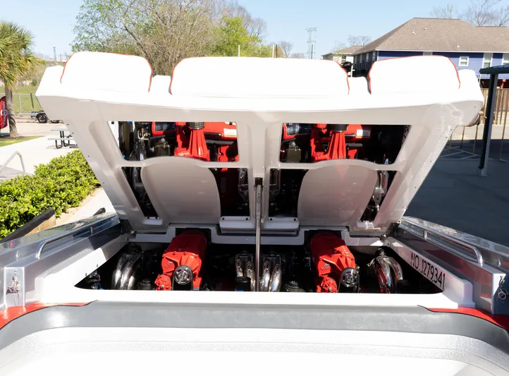  Yacht Photos Pics 2017 Formula 382 FASTech boat engine compartment with open hatch, showcasing powerful red engines.