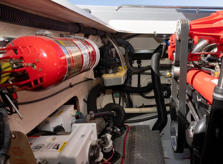  Yacht Photos Pics Engine compartment of a 2017 Formula 382 FASTech boat, featuring fire extinguisher and mechanical components.