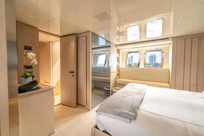  Yacht Photos Pics Luxurious Sanlorenzo SX76 2021 yacht interior with elegant bedroom and large windows.