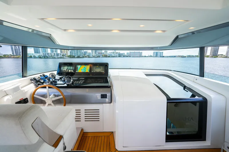  Yacht Photos Pics Helm of 2021 Sanlorenzo SX76 yacht with modern navigation equipment and panoramic views.