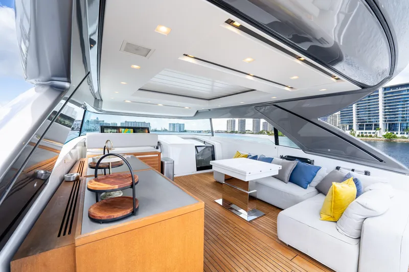  Yacht Photos Pics Luxurious 2021 Sanlorenzo SX76 yacht interior with modern seating and cityscape view.