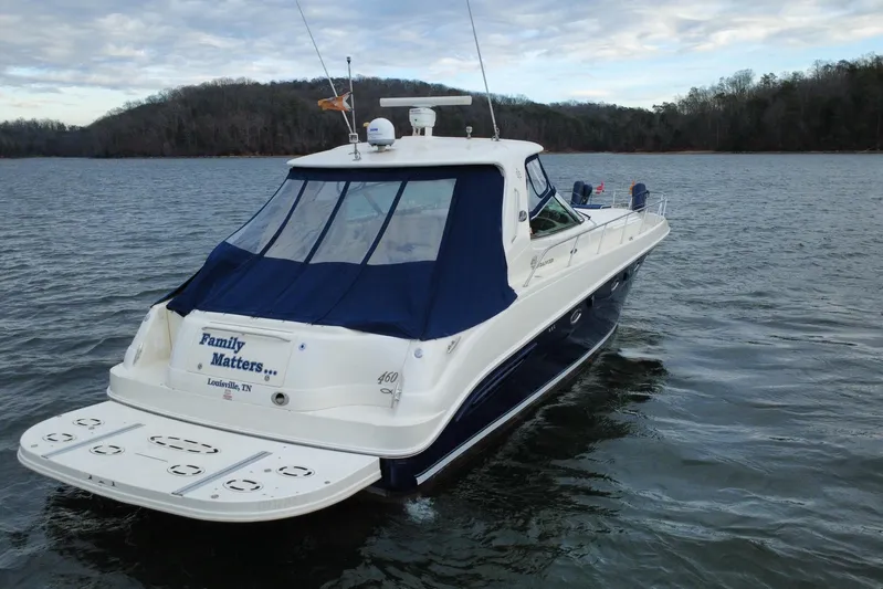  Yacht Photos Pics 2004 Sea Ray Sundancer 460 yacht on a lake, featuring "Family Matters" name.