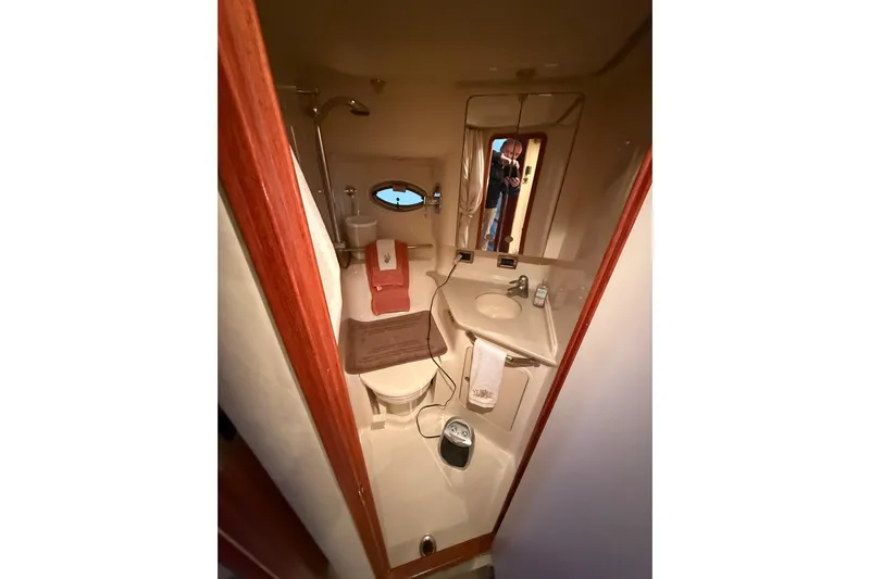  Yacht Photos Pics 2004 Sea Ray Sundancer 460 yacht bathroom with sink, toilet, and mirror.
