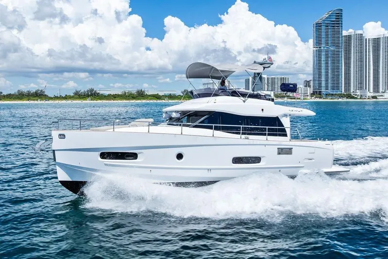 Roma Yacht Photos Pics Azimut Magellano 43 yacht cruising near city skyline, 2021 model.