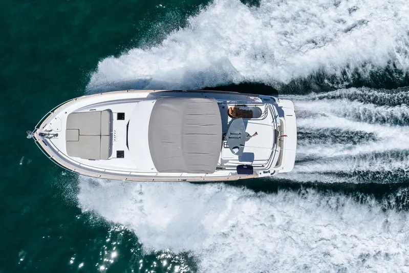 Roma Yacht Photos Pics Azimut Magellano 43 yacht cruising on open water, aerial view, 2021 model.