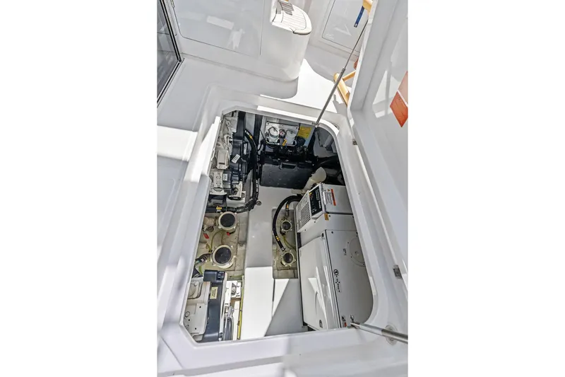 Roma Yacht Photos Pics Engine compartment of 2021 Azimut Magellano 43 yacht, showcasing mechanical components.