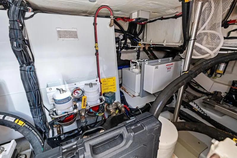 Roma Yacht Photos Pics Engine room of 2021 Azimut Magellano 43 yacht, showcasing mechanical components and wiring.