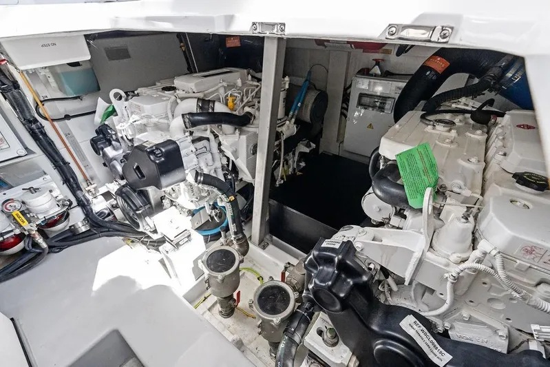 Roma Yacht Photos Pics Engine room of 2021 Azimut Magellano 43 yacht, showcasing dual engines and mechanical components.