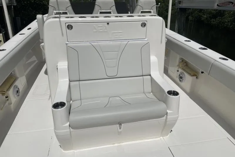  Yacht Photos Pics 2022 SeaVee 370z boat seating area with cup holders and sleek design.