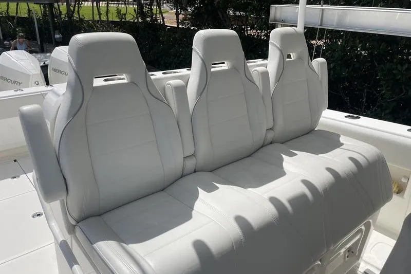  Yacht Photos Pics White leather seating on a 2022 SeaVee 370z boat, featuring three ergonomic seats.