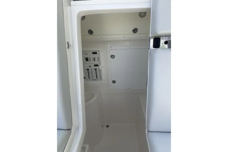  Yacht Photos Pics Interior view of 2022 SeaVee 370z boat, featuring control panels and storage compartments.