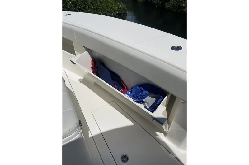  Yacht Photos Pics 2022 SeaVee 370z boat storage compartment with life jackets inside.