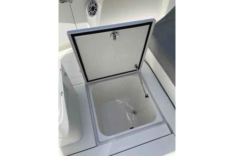  Yacht Photos Pics Open storage compartment on 2022 SeaVee 370z boat, featuring a sleek white design.