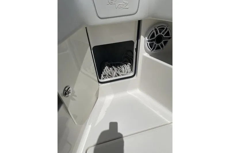  Yacht Photos Pics 2022 SeaVee 370z boat storage compartment with rope and speaker detail.