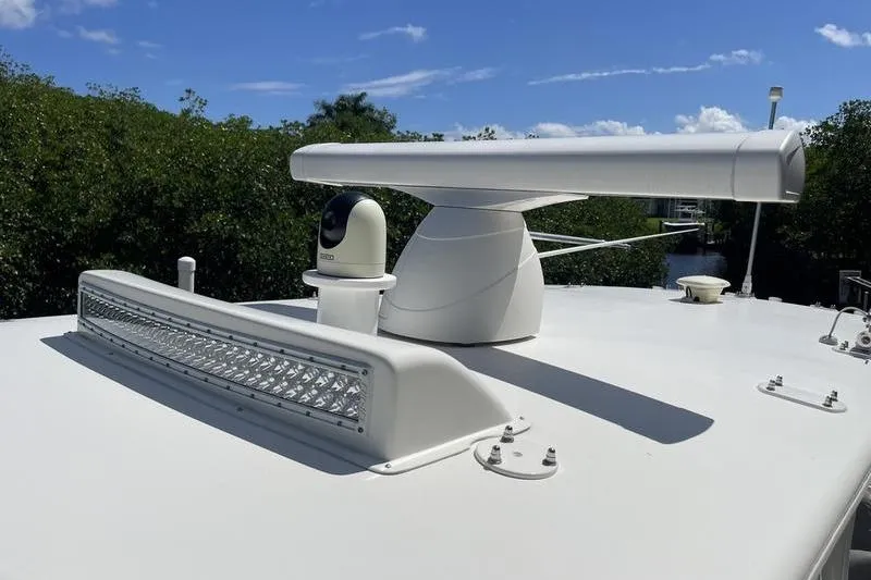  Yacht Photos Pics Radar and camera equipment on 2022 SeaVee 370z boat under clear blue sky.