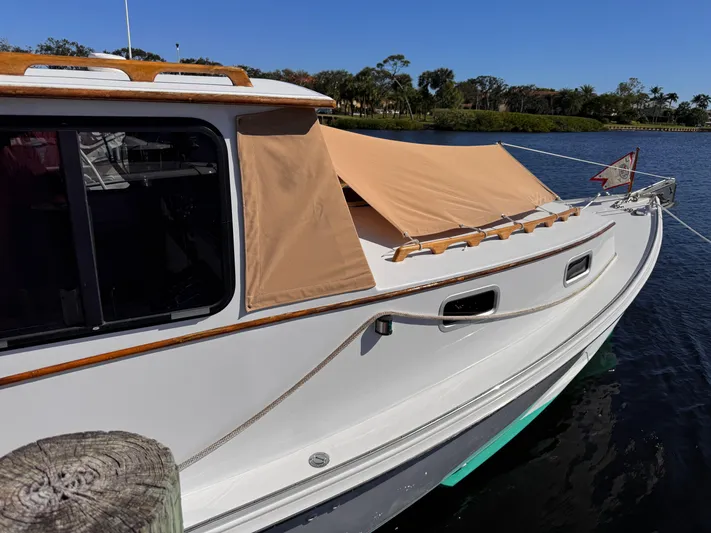 Grey Dawn Yacht Photos Pics Tent awning over forward hatch