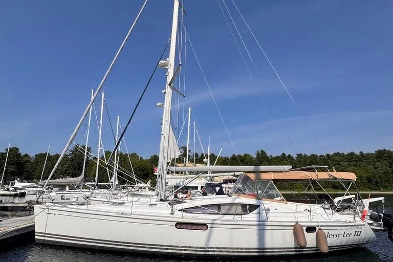  Yacht Photos Pics 2011 Jeanneau 50 Deck Saloon sailboat docked under clear blue sky.