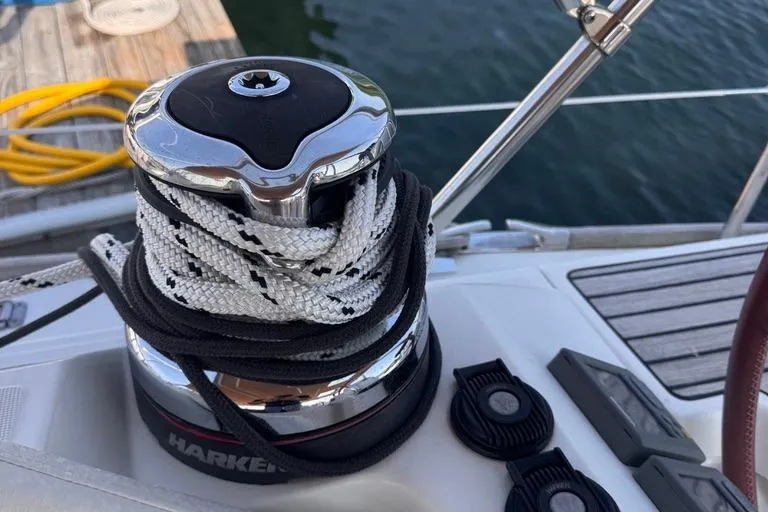  Yacht Photos Pics Winch on 2011 Jeanneau 50 Deck Saloon sailboat, with ropes coiled neatly.