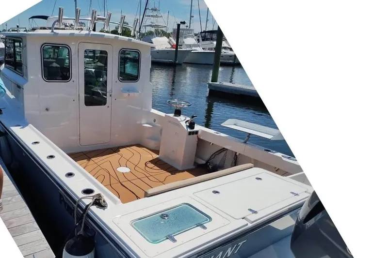  Yacht Photos Pics 2019 Parker 2520 XL Sport Cabin boat docked at marina, featuring spacious deck and cabin.