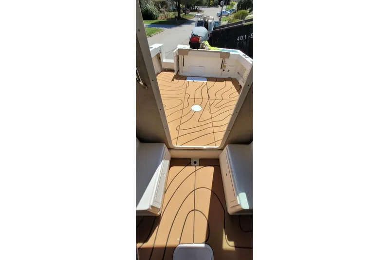  Yacht Photos Pics Interior view of 2019 Parker 2520 XL Sport Cabin with wooden flooring.