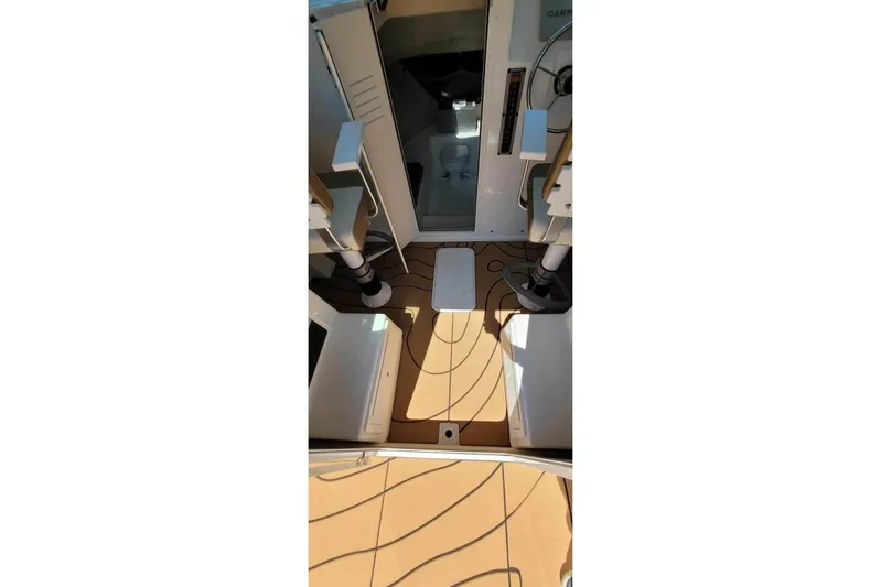  Yacht Photos Pics 2019 Parker 2520 XL Sport Cabin interior with teak flooring and modern controls.