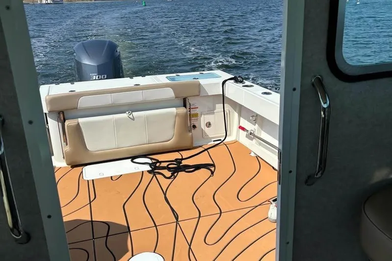  Yacht Photos Pics 2019 Parker 2520 XL Sport Cabin boat interior with Yamaha 300 engine on water.