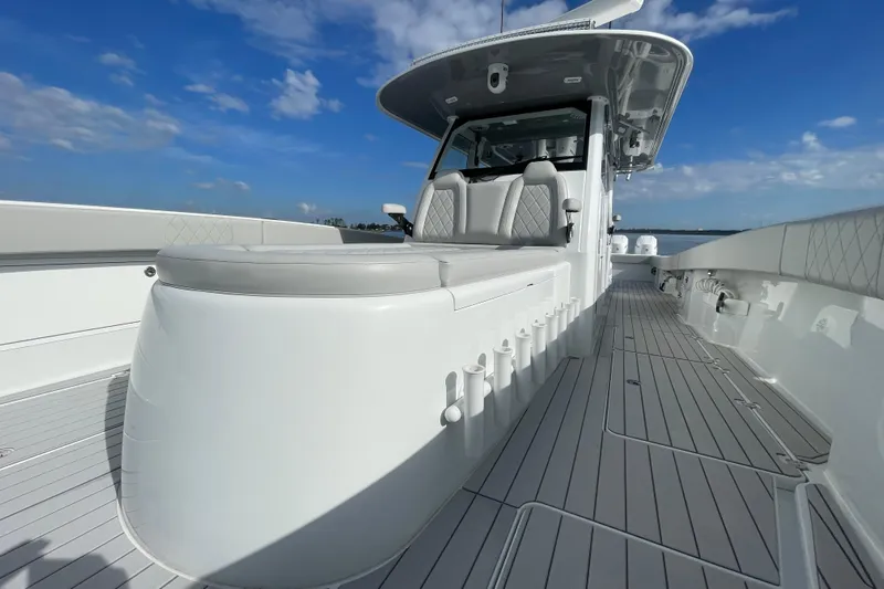  Yacht Photos Pics 2022 Freeman 47 boat deck with seating, sleek design, and clear blue sky.