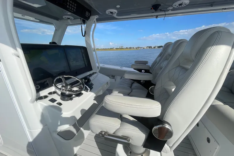  Yacht Photos Pics Luxurious interior of 2022 Freeman 47 boat with plush seating and advanced controls.