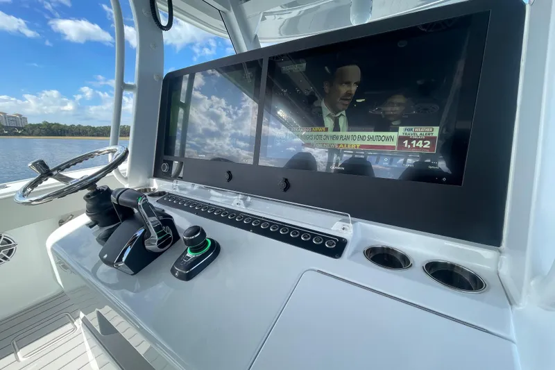  Yacht Photos Pics Control panel of a 2022 Freeman 47 boat with a large display screen.