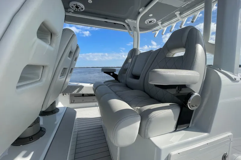  Yacht Photos Pics Luxurious seating on 2022 Freeman 47 boat with ocean view and blue sky.