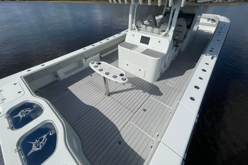  Yacht Photos Pics 2022 Freeman 47 boat with spacious deck and modern amenities on calm water.