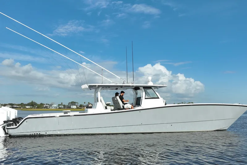  Yacht Photos Pics 2022 Freeman 47 boat on calm water under a clear blue sky.