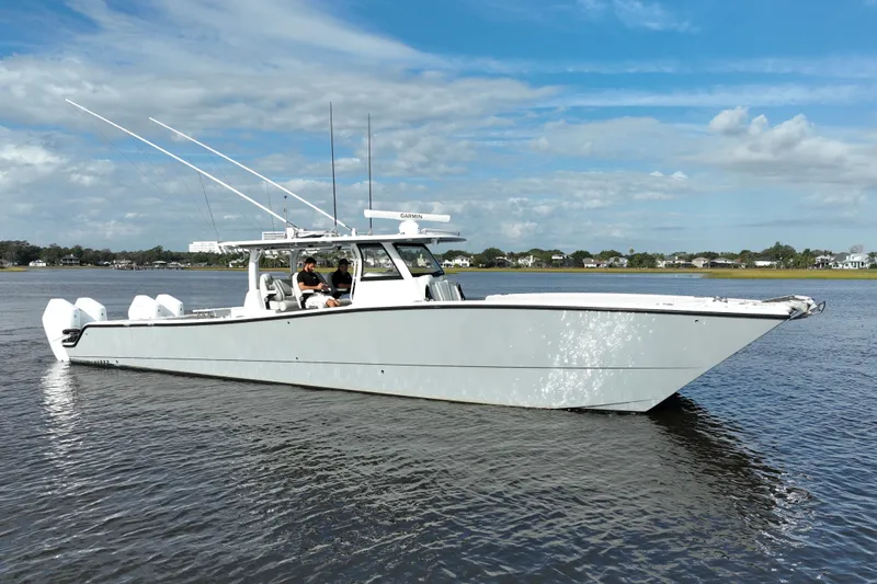  Yacht Photos Pics 2022 Freeman 47 boat on calm water under a blue sky.