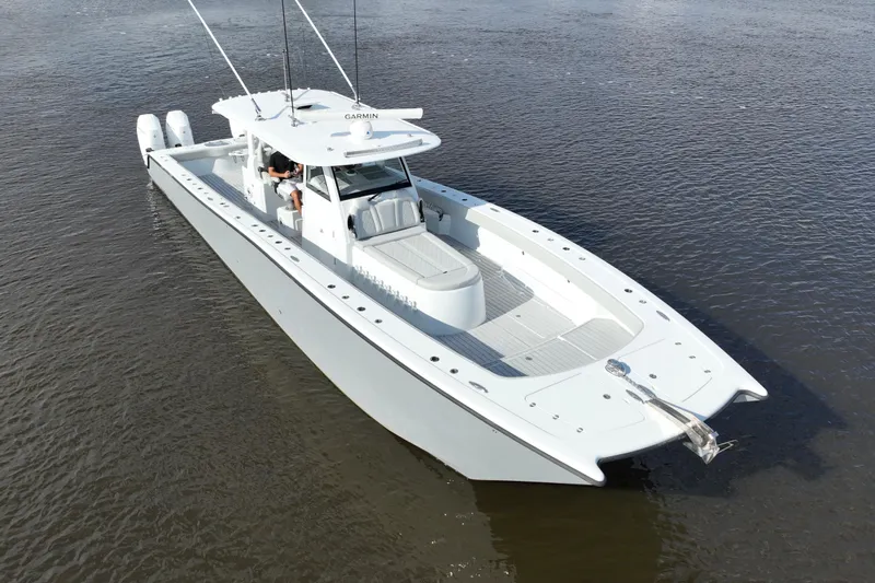  Yacht Photos Pics 2022 Freeman 47 boat on calm water, featuring sleek design and twin engines.