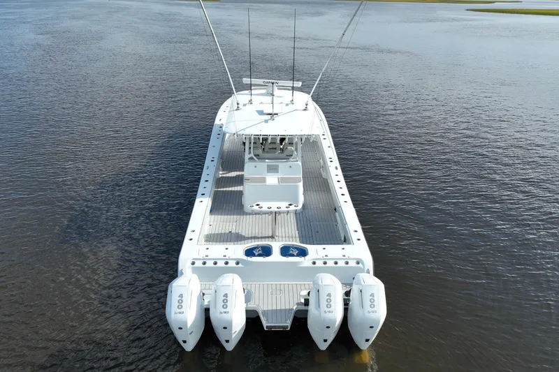  Yacht Photos Pics Freeman 47 boat, 2022 model, with quad engines on calm water.