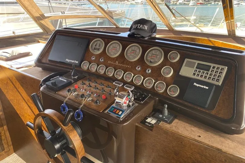  Yacht Photos Pics 1990 Riva Corsaro 20 yacht dashboard with gauges, controls, and captain's hat.