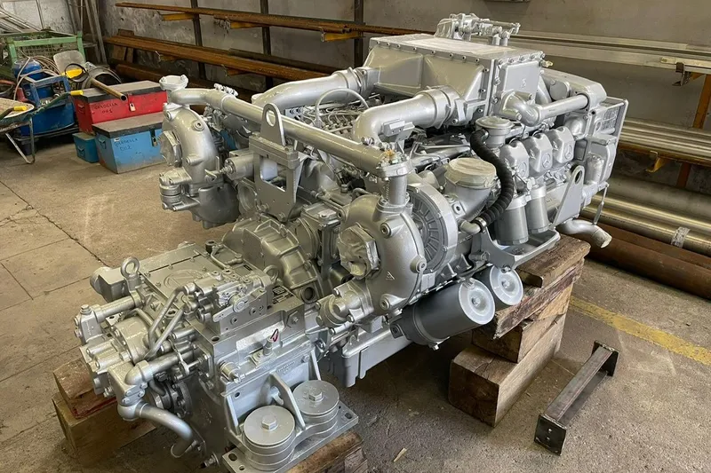  Yacht Photos Pics Engine of a 1990 Riva Corsaro 20 boat, displayed in a workshop setting.