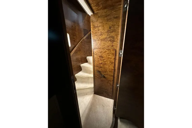  Yacht Photos Pics Interior of 1990 Riva Corsaro 20 yacht with elegant wooden staircase and paneling.