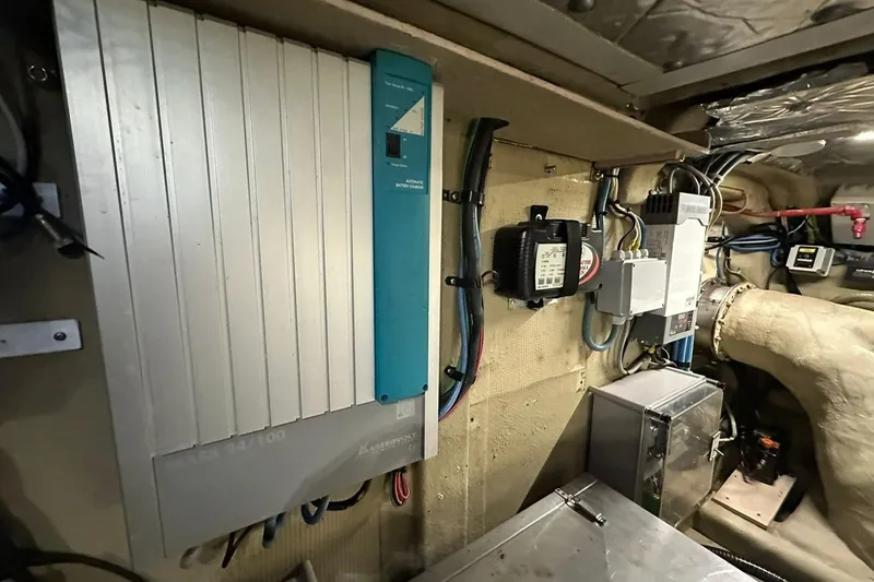  Yacht Photos Pics Electrical system inside a 1990 Riva Corsaro 20 boat, featuring various components and wiring.