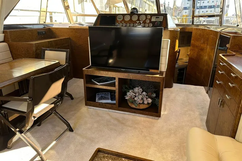  Yacht Photos Pics Luxurious interior of a 1990 Riva Corsaro 20 yacht with elegant furnishings and modern amenities.