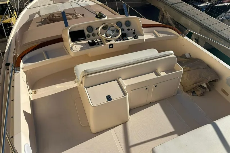  Yacht Photos Pics 1990 Riva Corsaro 20 yacht cockpit with steering wheel and control panel.