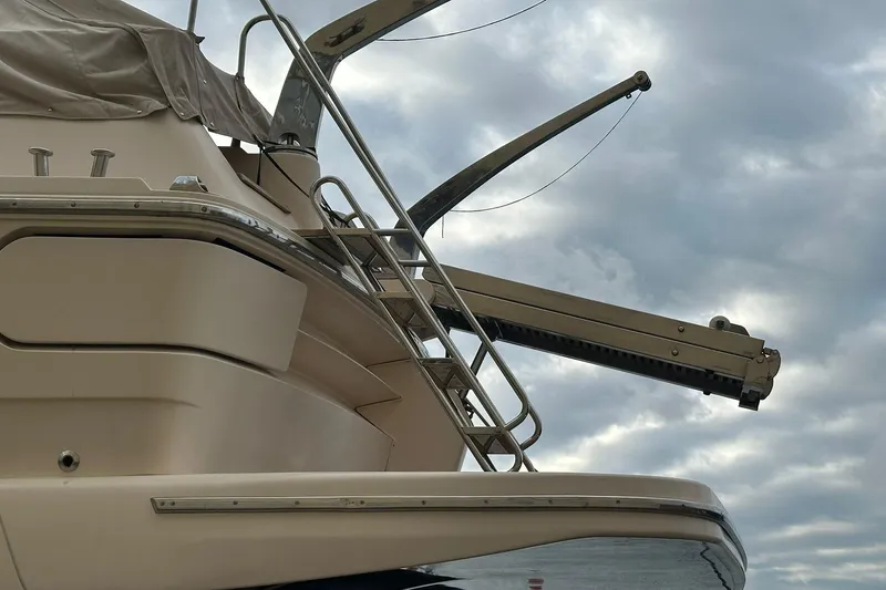  Yacht Photos Pics 1990 Riva Corsaro 20 yacht with sleek design against cloudy sky backdrop.