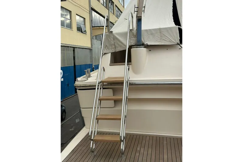  Yacht Photos Pics 1990 Riva Corsaro 20 yacht with wooden steps and metal railing.