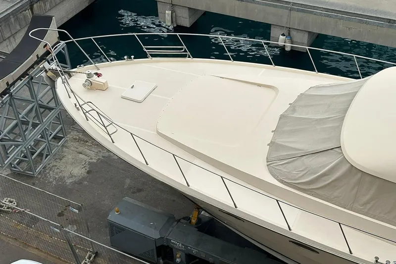  Yacht Photos Pics 1990 Riva Corsaro 20 yacht docked, showcasing sleek design and spacious deck.