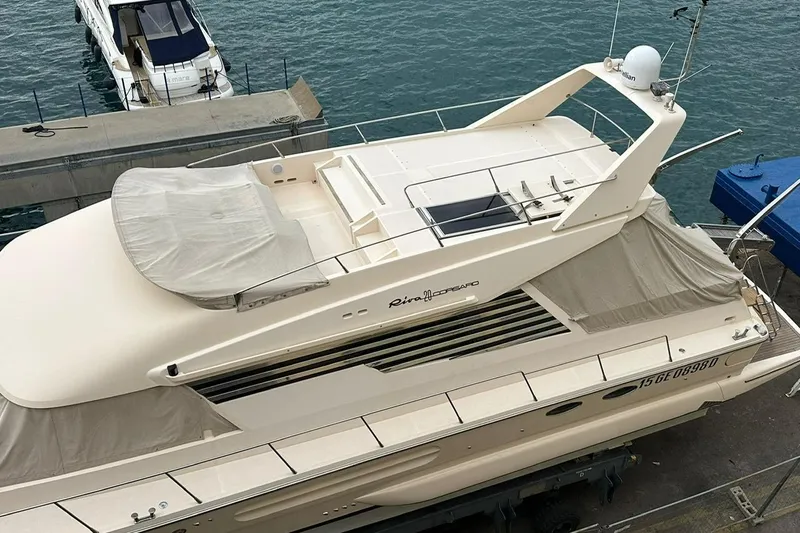  Yacht Photos Pics 1990 Riva Corsaro 20 yacht docked at marina, aerial view.