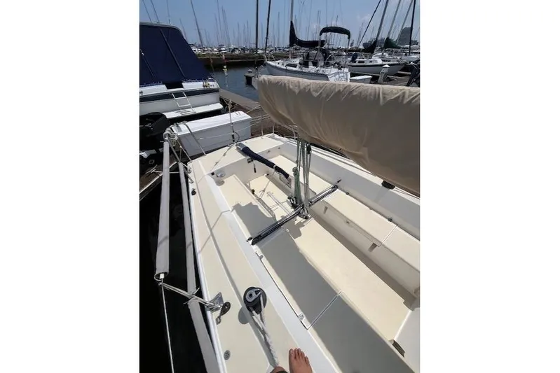  Yacht Photos Pics 2005 J Boats J/100 sailboat docked in marina, showcasing deck and rigging.