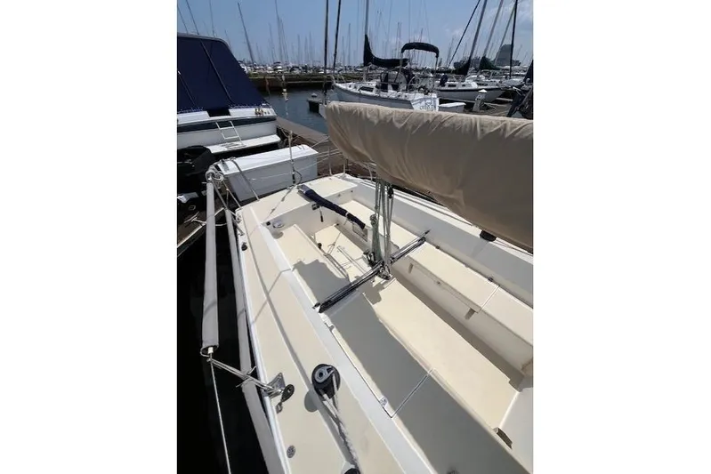  Yacht Photos Pics 2005 J Boats J/100 sailboat docked in marina, showcasing deck and rigging.