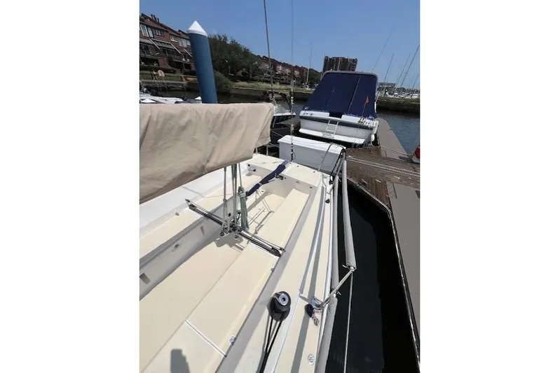  Yacht Photos Pics 2005 J Boats J/100 sailboat docked at marina, side view.